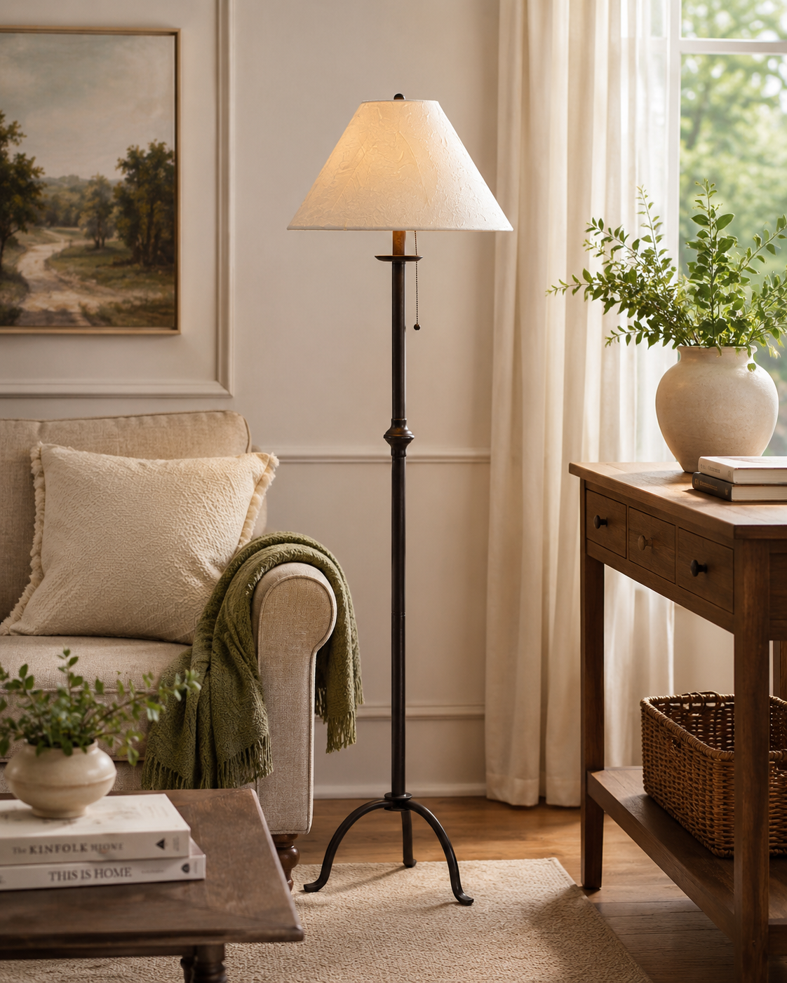 Living room with a floor lamp, sofa, and decorative items.