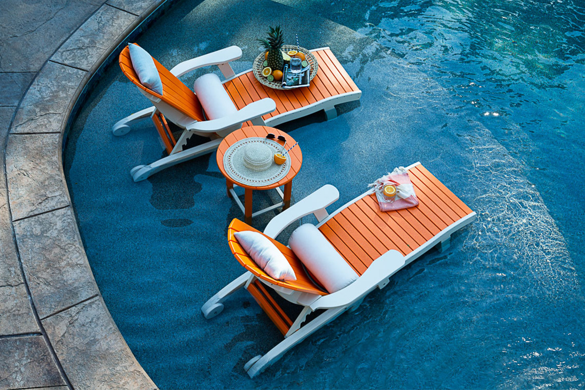 outdoor lounge chairs in pool